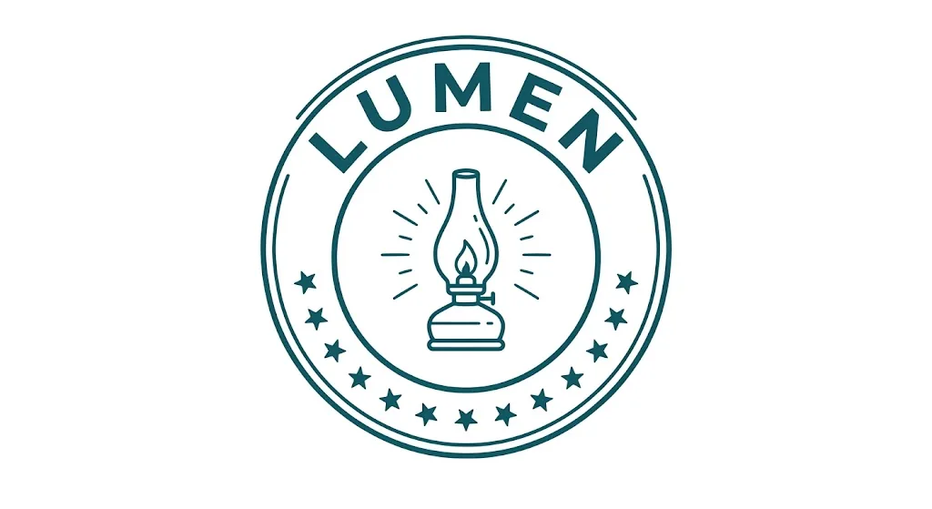 A vintage circular emblem in deep teal line work on white: LUMEN curved along the top of the ring, a small row of stars along the bottom, and an oil lamp with light rays in the centre.
